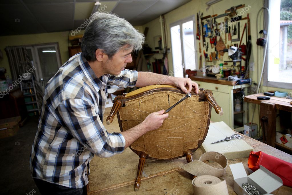 depositphotos_41327467-stock-photo-craftsman-repairing-armchair